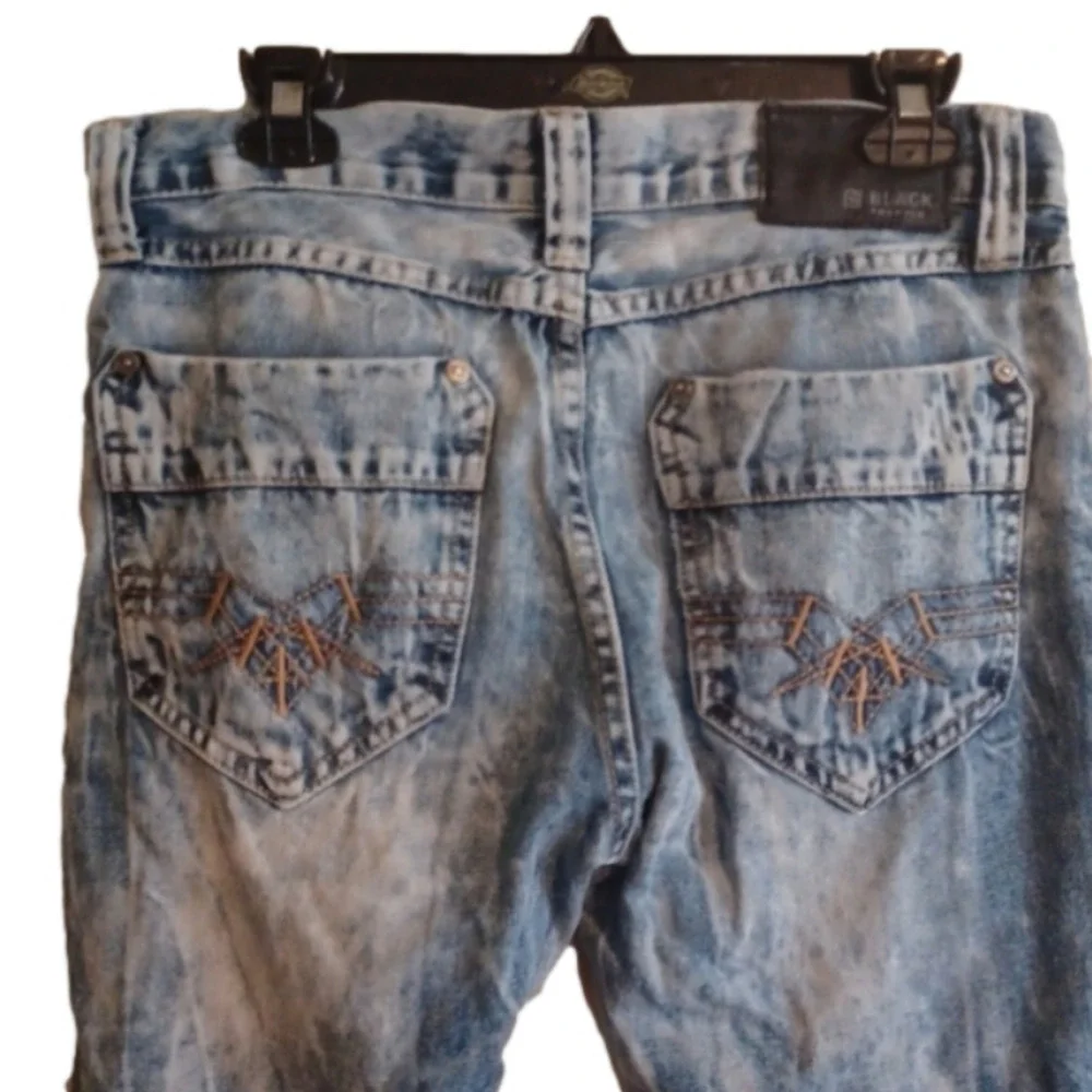 Black brand super distressed, acid wash looking jeans.Size 30x32.